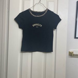 black crop top with design on it